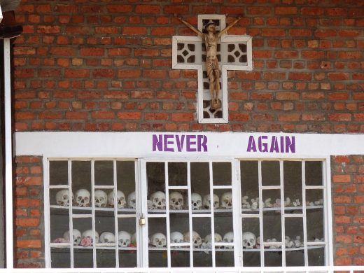 1024px-never_again_-_with_display_of_skulls_of_victims_-_courtyard_of_genocide_memorial_church_-_karongi-kibuye_-_western_rwanda_-_01