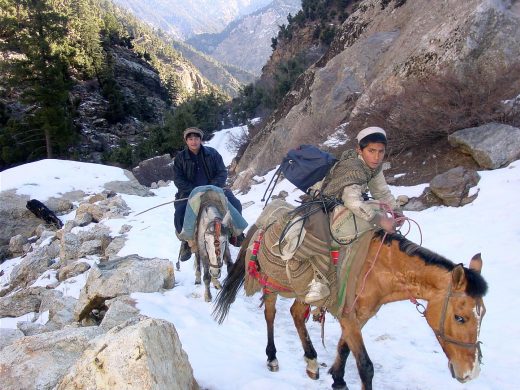 these-two-afghan-boys-travel-safely-over-rough-snow-covered-terrain_pixnio